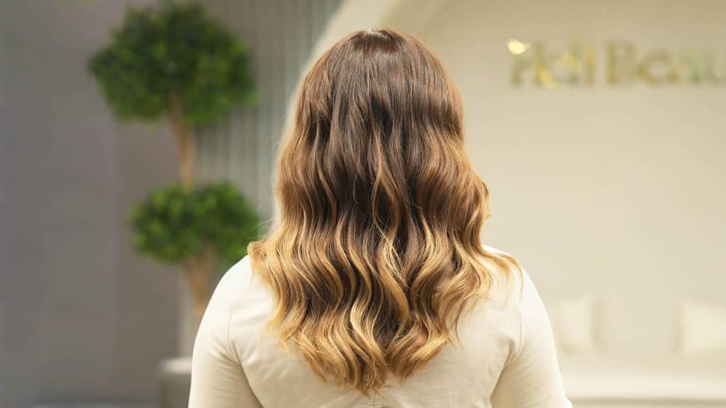 Caramel ombre hair color with warm tone