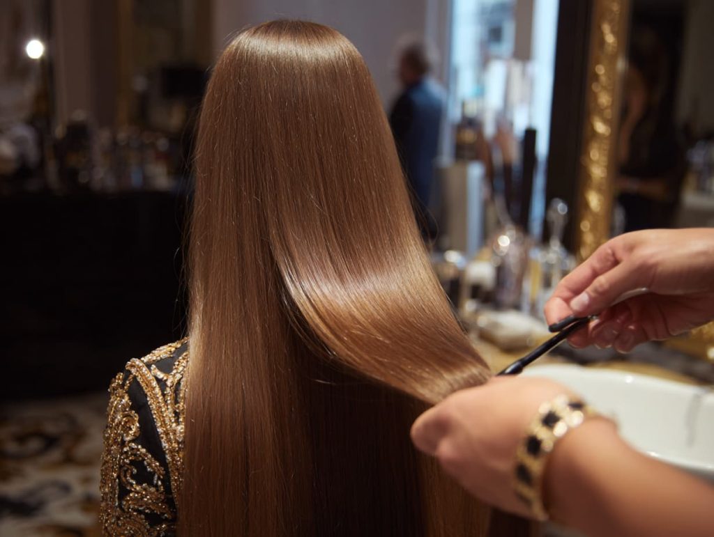 Hair extension aftercare at luxury salon, smooth brushed extensions